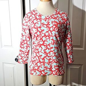 J.MCLAUGHLIN, Women's stretch top. Size medium.  Coral/red geometric print.